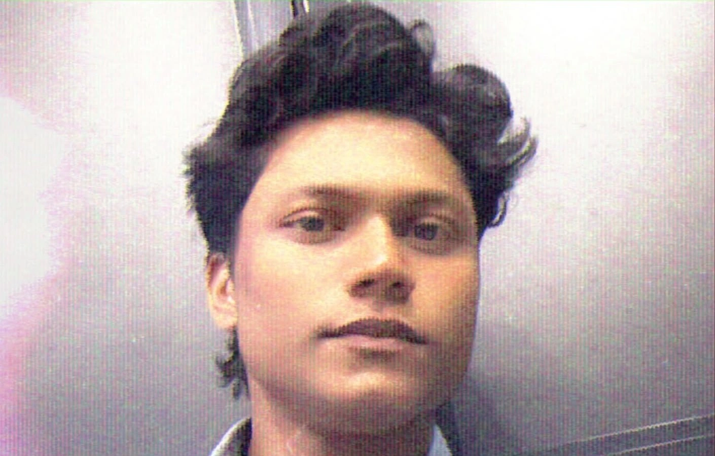 ALT Text: Best freelance digital marketing expert in Palakkad – portrait of a young man with styled hair, looking at the camera.